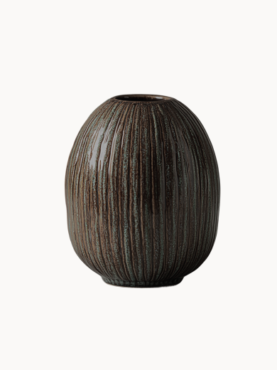 An oval, dark brown ceramic vase with a textured surface covered in vertical ribbed lines and subtle green speckled details, on a white background.
